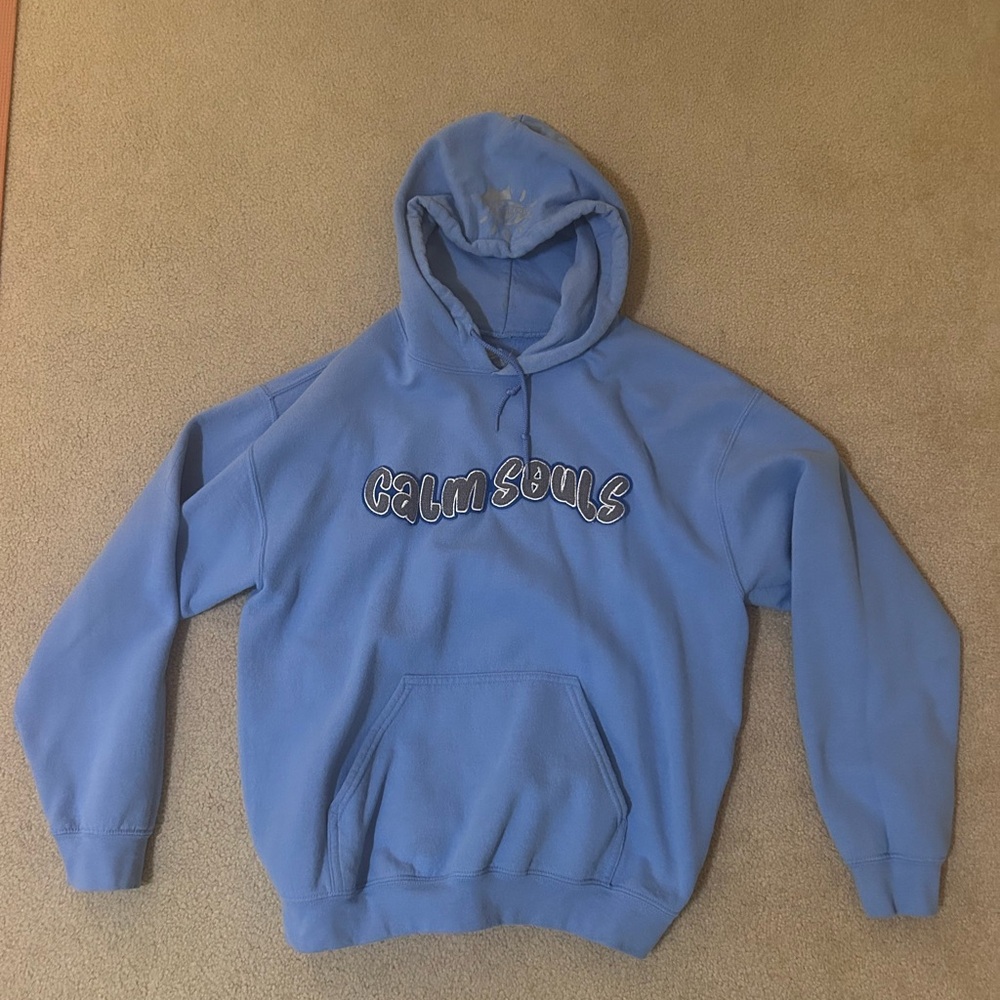 Blue graphic hoodie, “calm souls” bubble fluffy print on front, design on hood